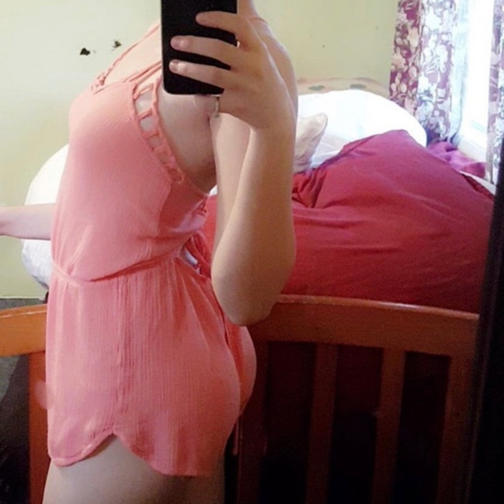 Pink romper.